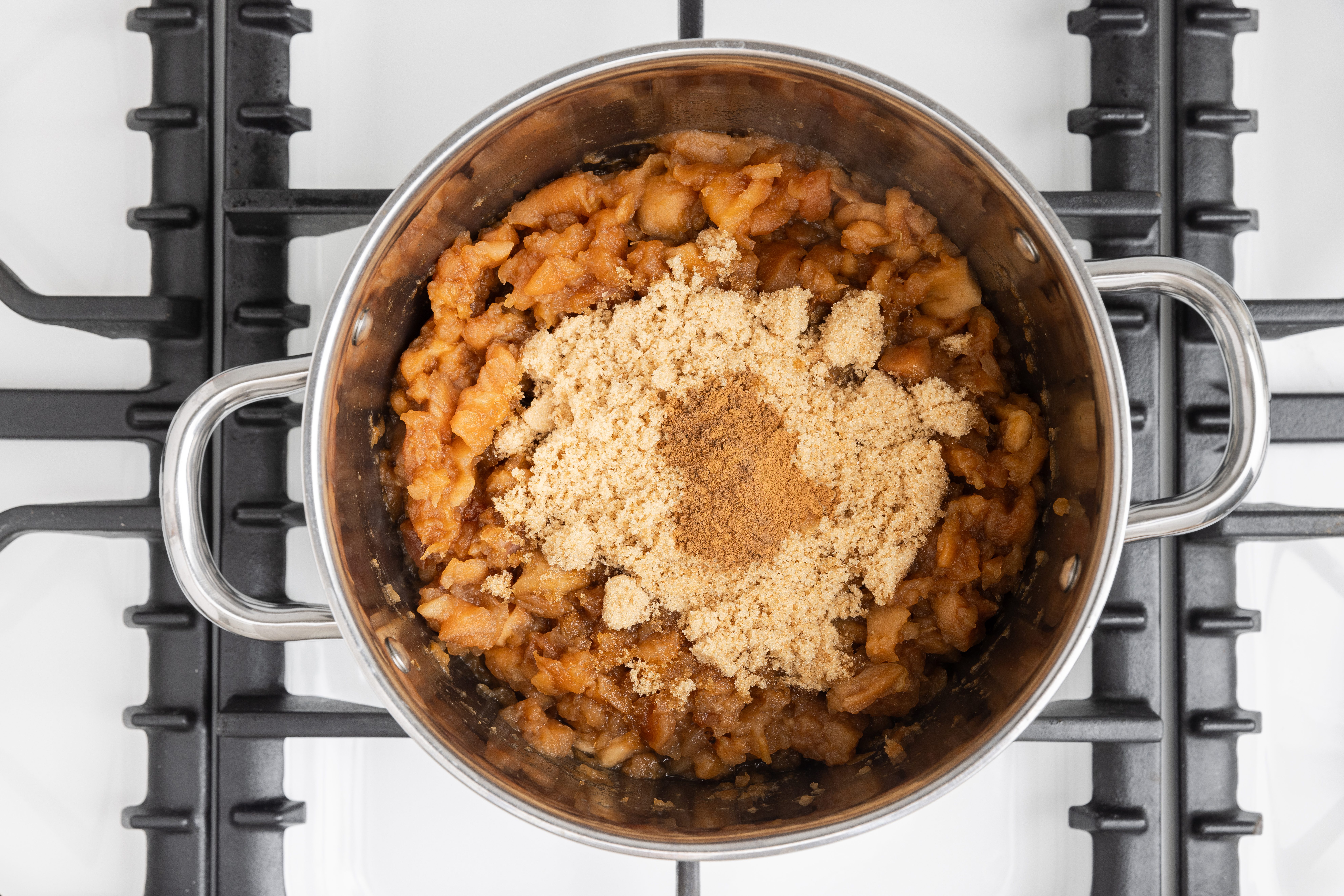 Apple mixture filling being prepared on stockpot.