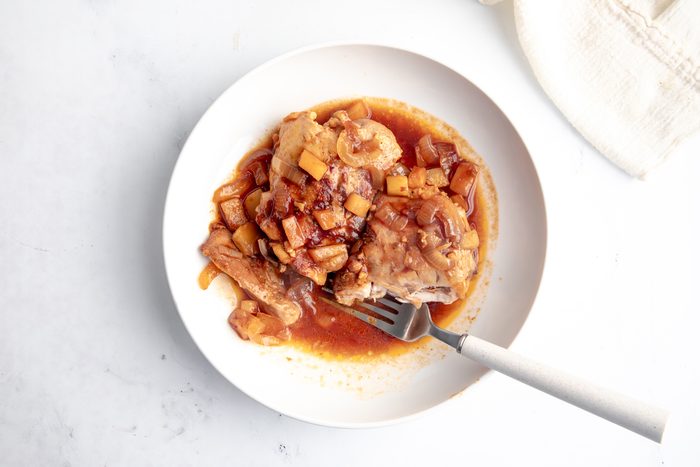 Overhead beauty shot for Taste of Home Apple Chicken being served in a bowl.
