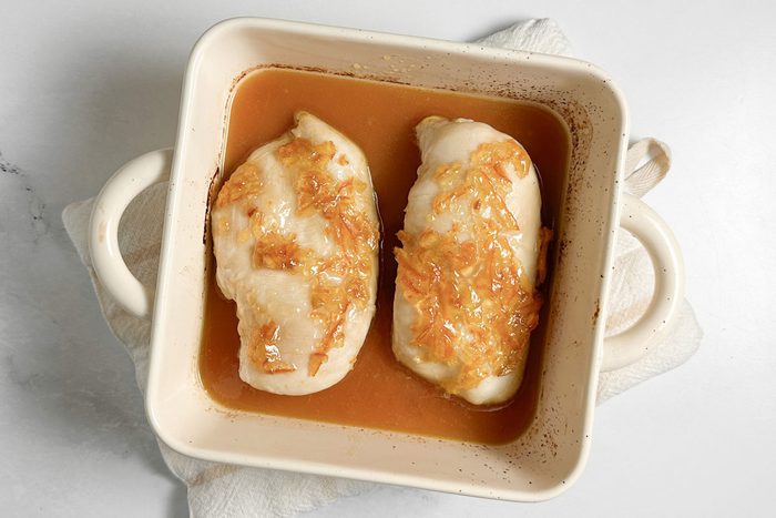 Taste of Home Baked Orange Chicken in a ceramic baking dish