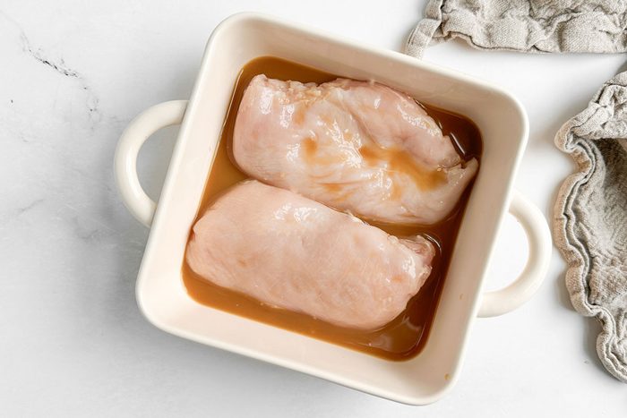 Unbaked Taste of Home Baked Orange Chicken in a ceramic baking dish