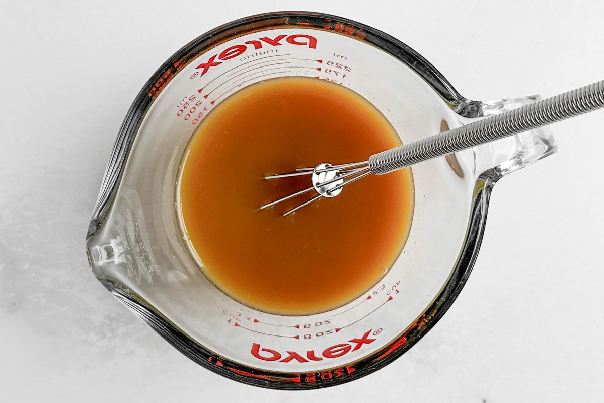 Marinade for Taste of Home Baked Orange Chicken in a pyrex measuring cup
