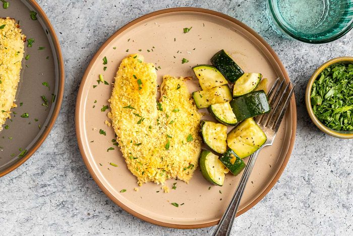 Taste of Home Baked Tilapia with Panko Bread Crumbs photo of the finished recipe served on plates.