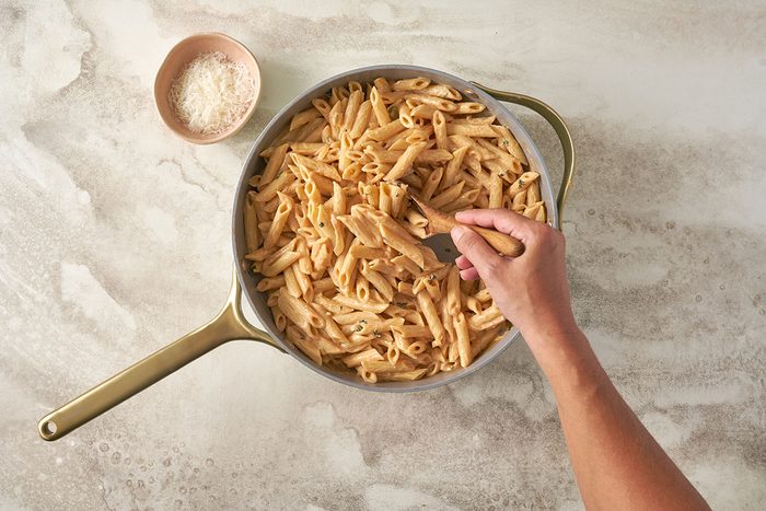 Stir the sauce into the cooked pasta, and sprinkle the remaining cheese on top before serving this Creamy Pasta recipe.