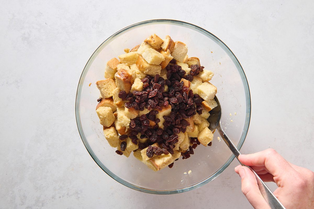 Combining the bread pudding ingredients in a large bowl