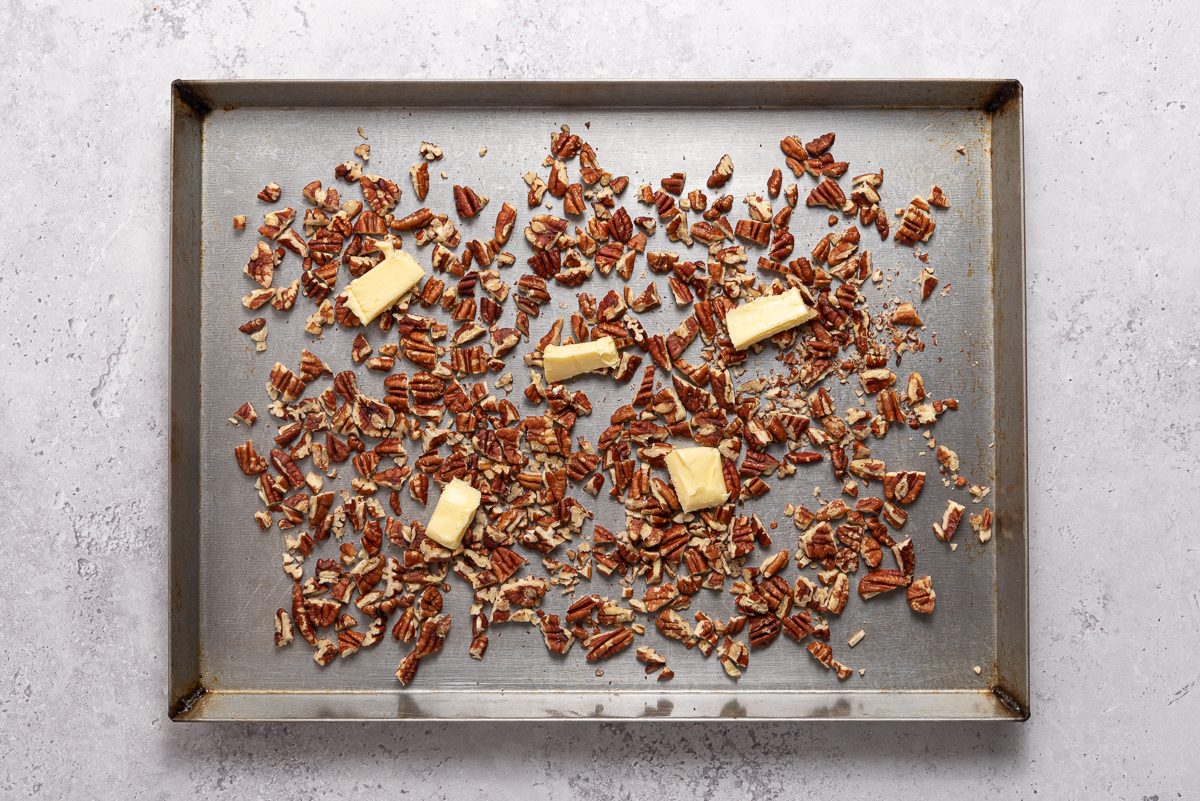 Chopped Pecans And Butter In Baking Pan