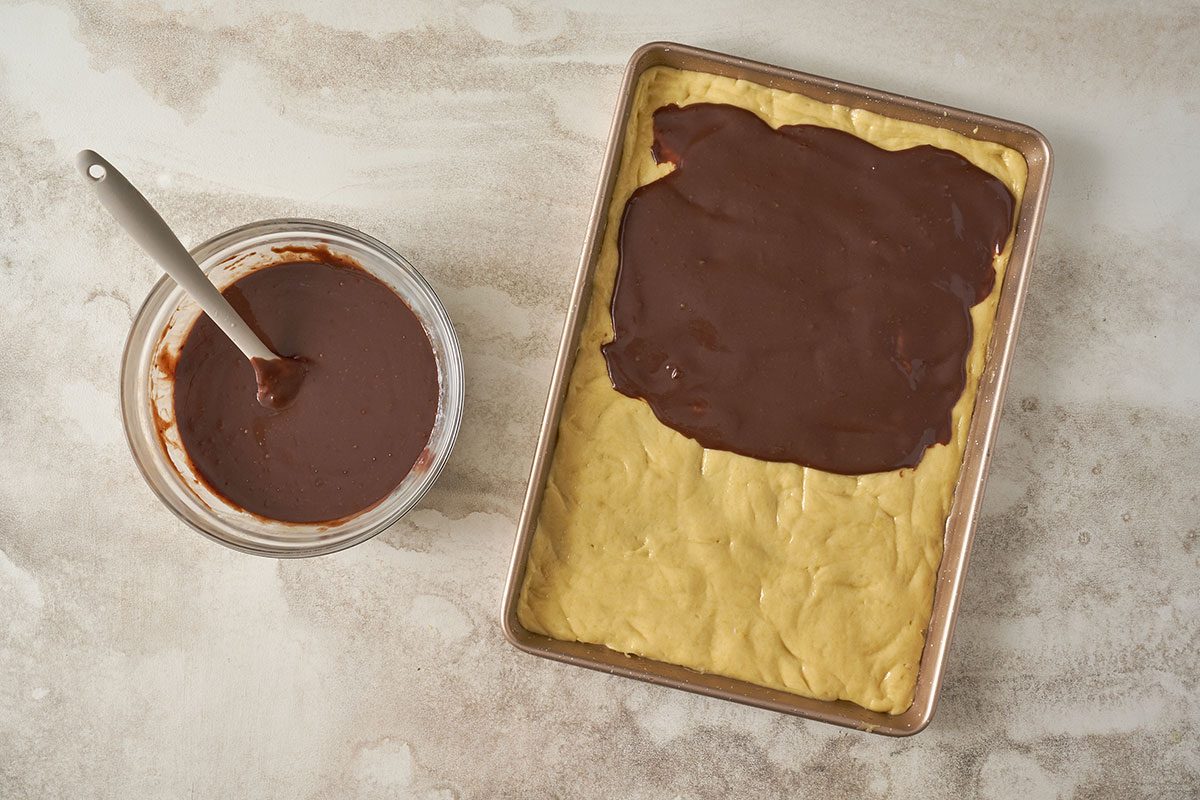 Taste of Home Cake Mix Bars: The chocolate layer is prepared by melting chocolate chips, condensed milk, and butter, and then poured over the cake mix base.