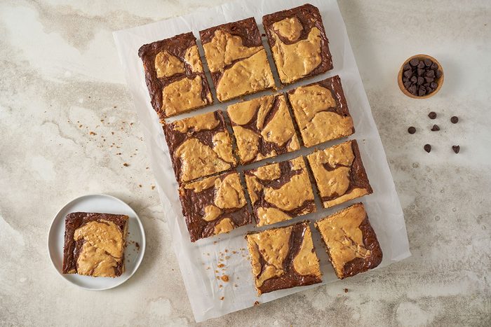 Taste of Home Cake Mix Bars: Finished Cake Mix Bars, topped with melted chocolate howcasing their rich texture and layered look.