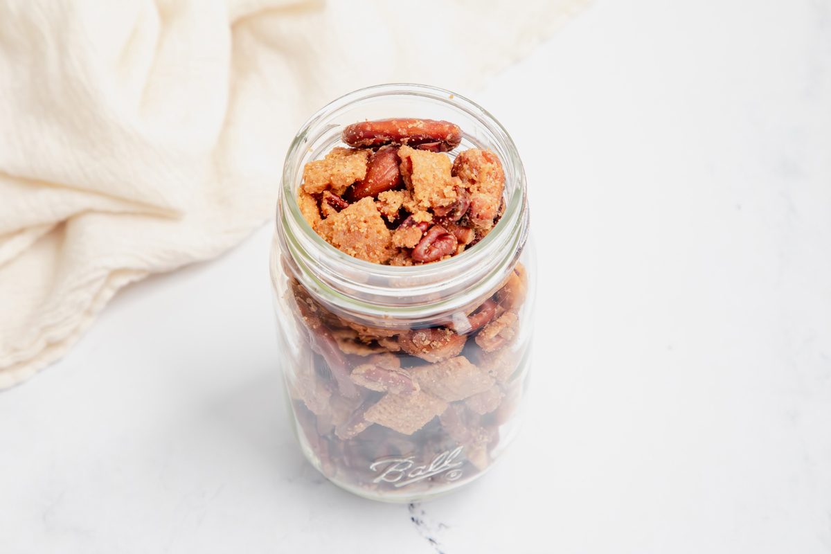 Beauty shot for Taste of Home Caramel Chex Mix in a mason jar.