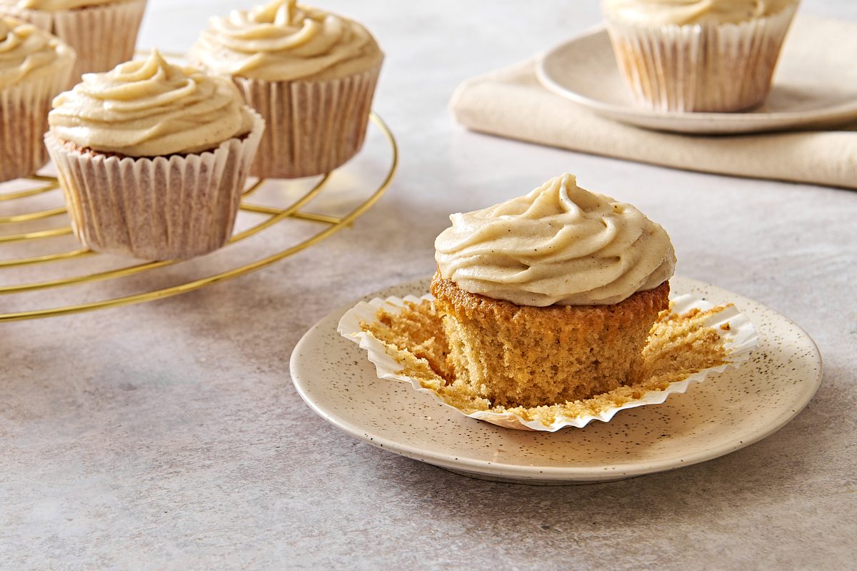 Closeup of a chai cupcake on a plate with the paper wrapper removed