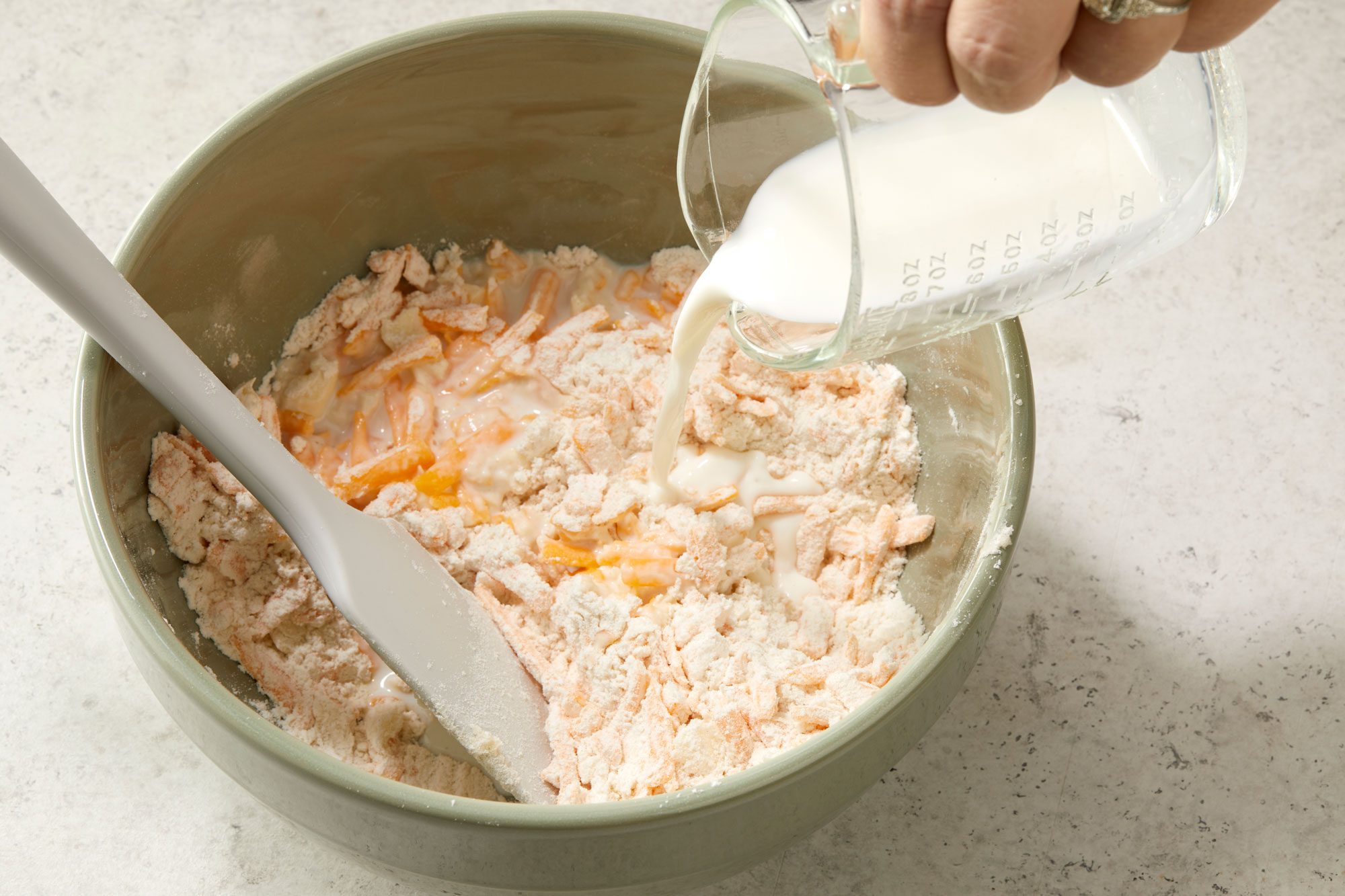 Gradually add milk just until moistened