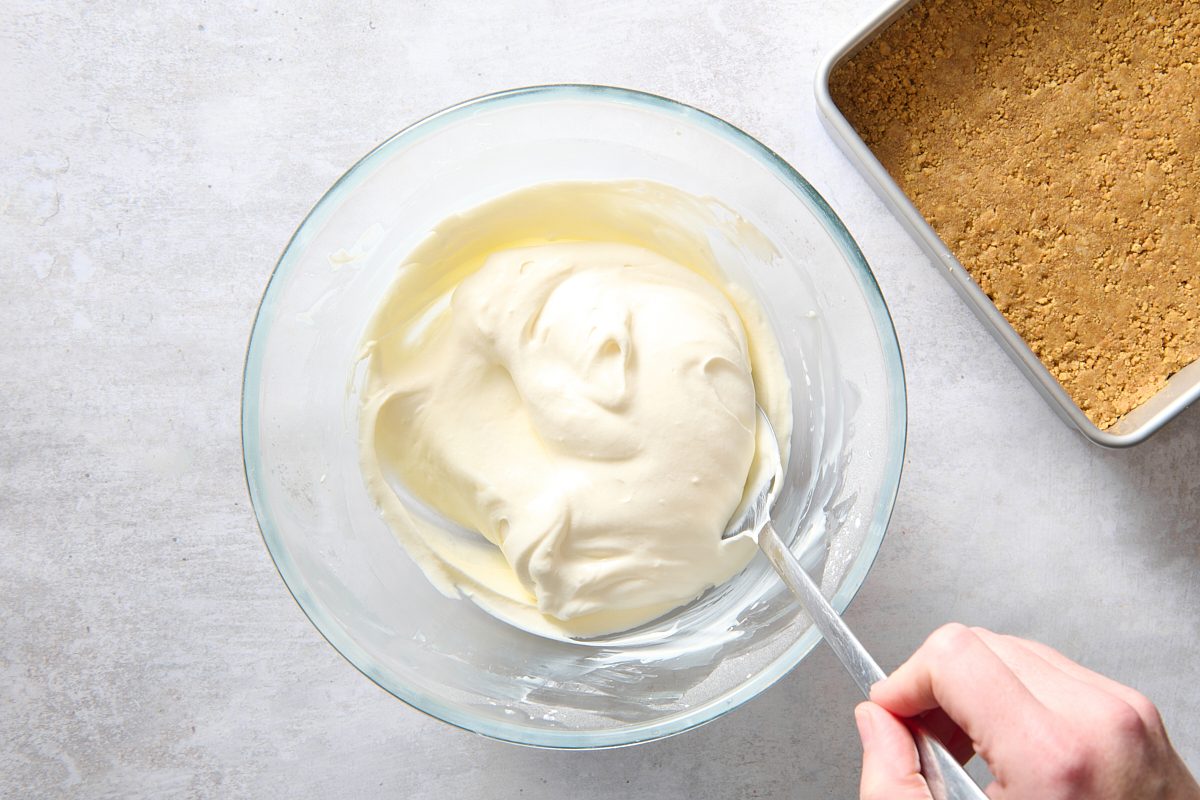 Folding the whipped topping into the cream cheese mixture