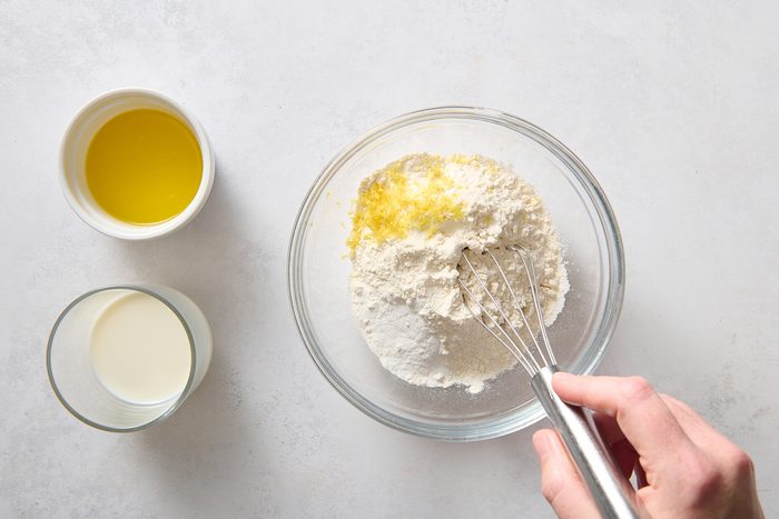 Whisking the dumpling batter ingredients