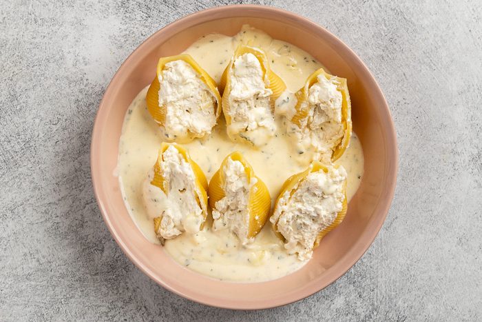 cream sauce poured over the shells.
