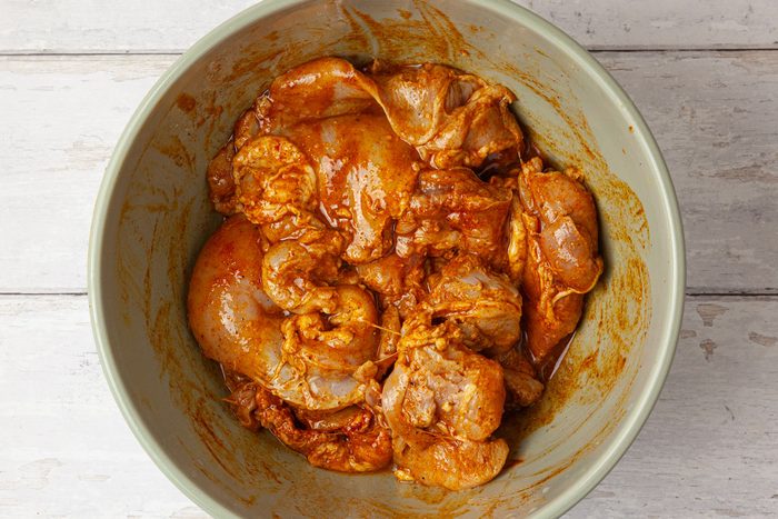 Step 1 of Taste of Home Chicken Shawarma is to marinate the chicken