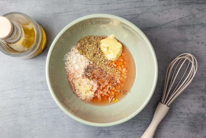 Step 3 of Taste of Home Chickpea Pasta Salad is to whisk together the red wine vinegar, lemon juice, crumbled feta, mustard, garlic, oregano, salt and pepper. Slowly drizzle in the olive oil, while continuing to mix until combined.