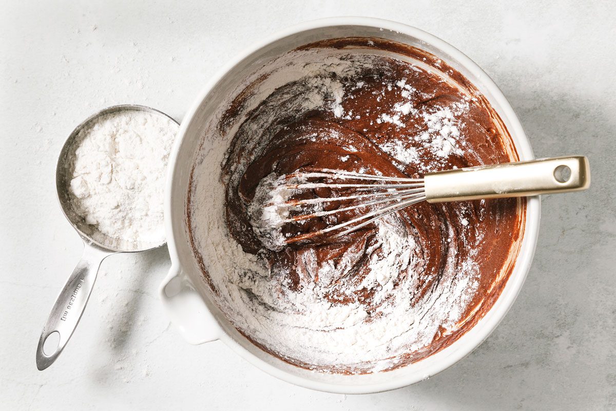 Gradually Stiring flour into batter