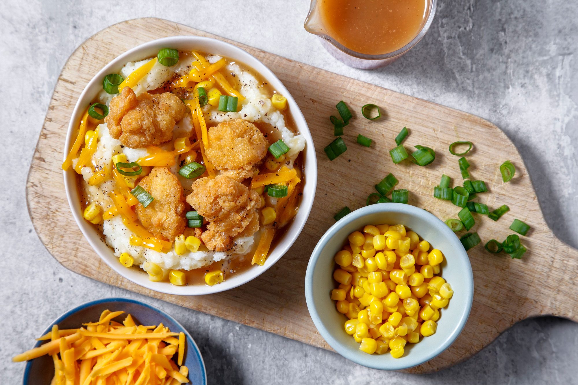 Copycat Kfc Mashed Potato Bowl served in bowl on a chopping board