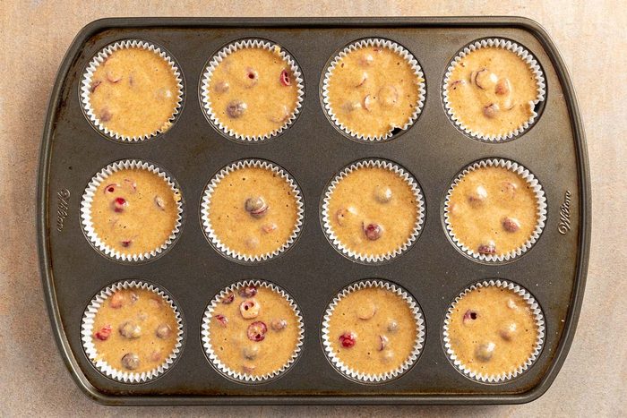 Cranberry Orange Muffins in muffin pan