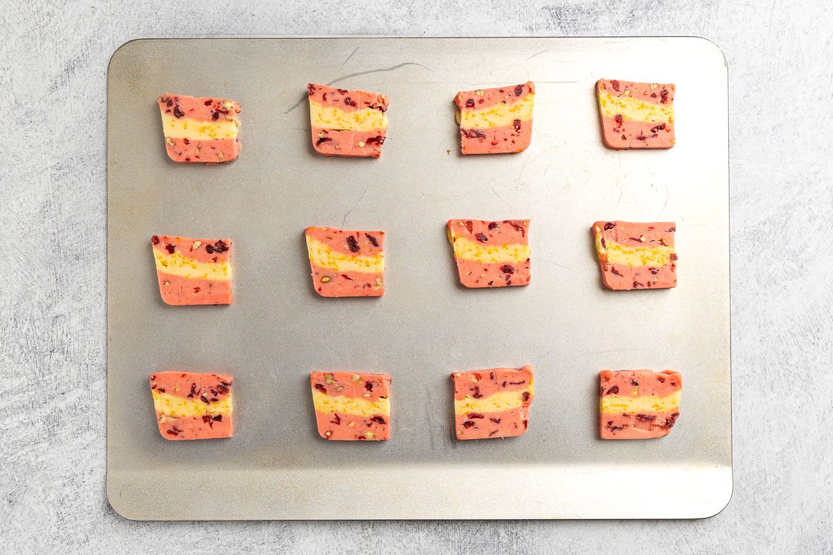 slicing the cookie dough and placing on cookie sheets.