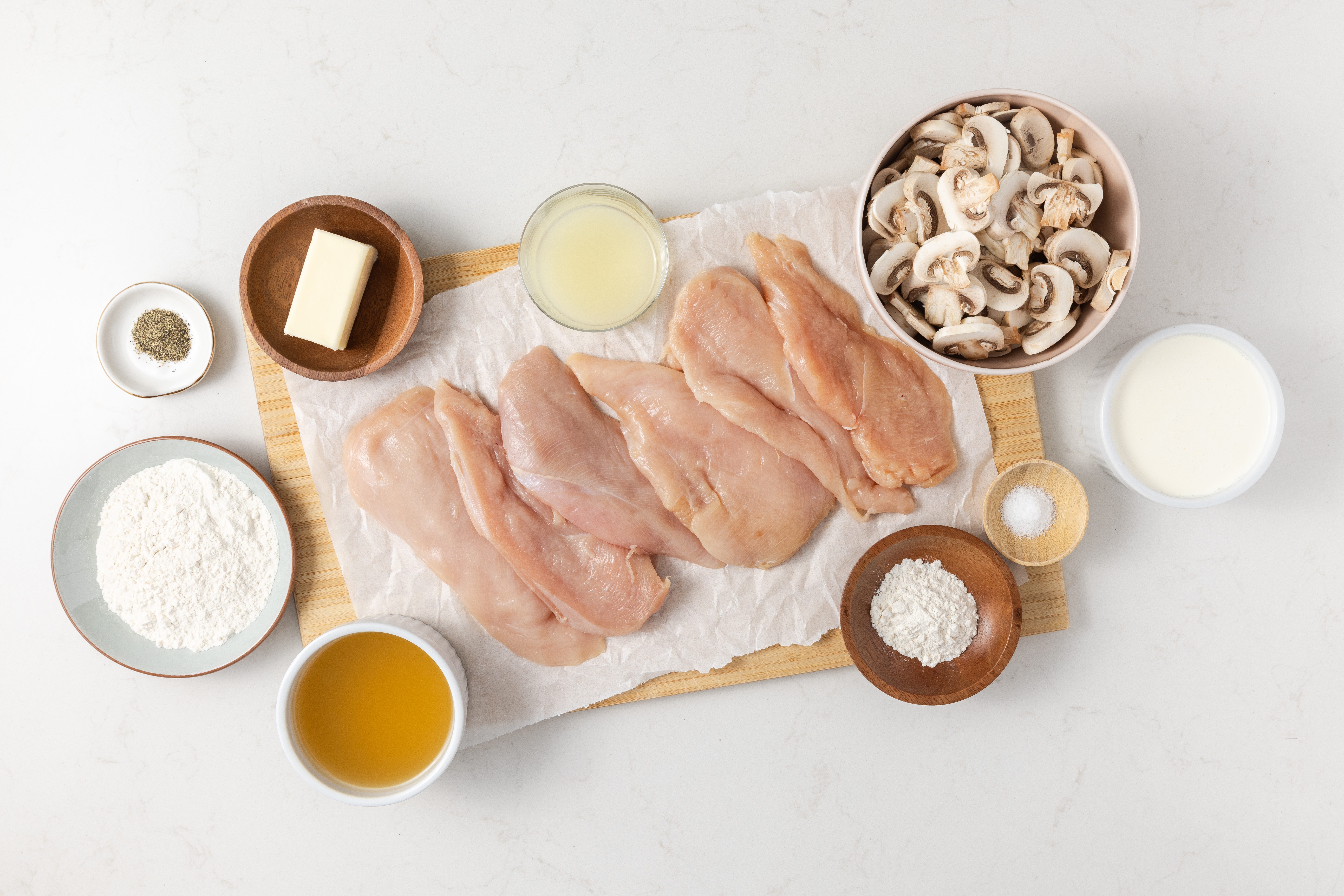 Ingredients for creamy lemon chicken on kitchen counter.