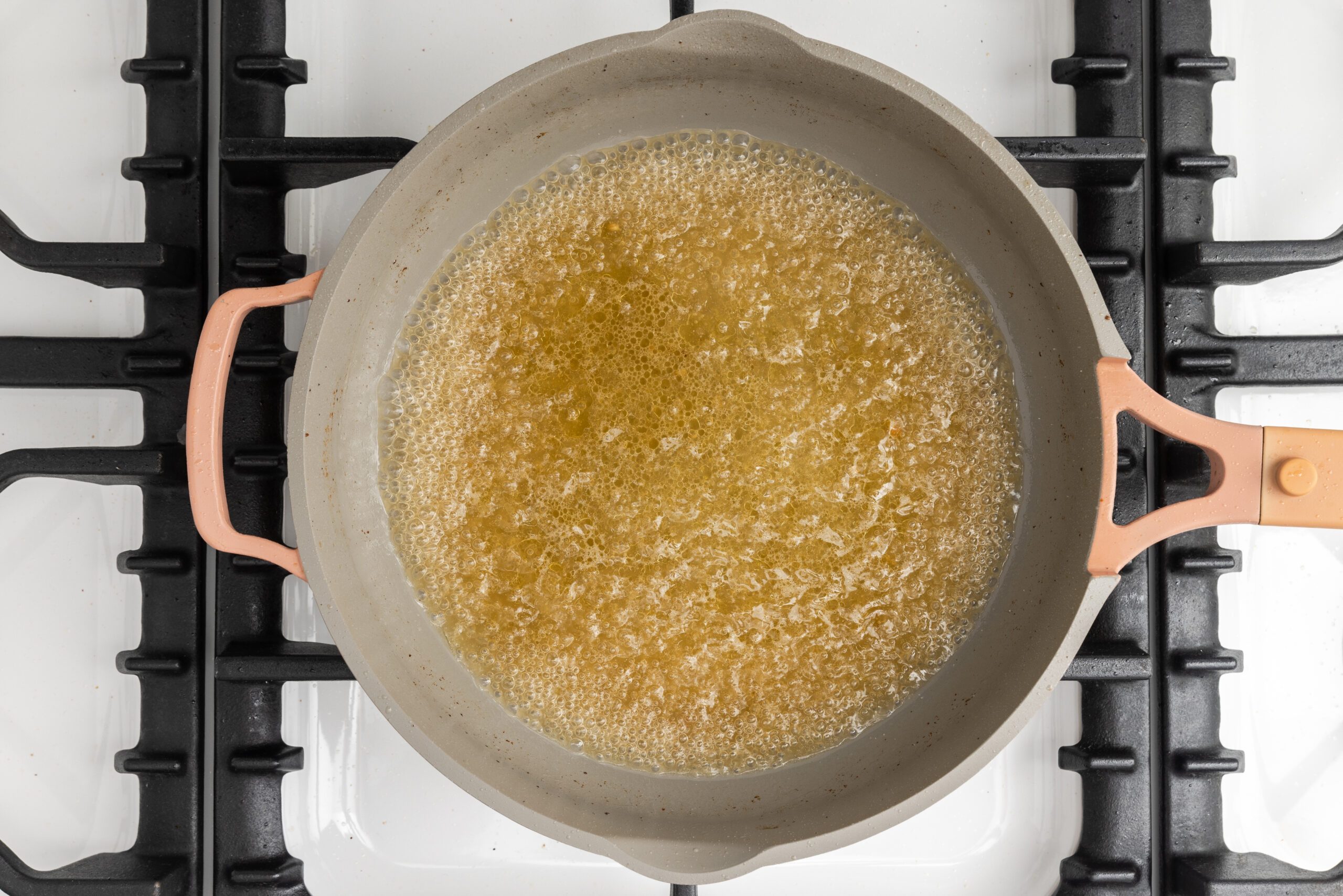 Sauce base being brought to a boil and reduced.