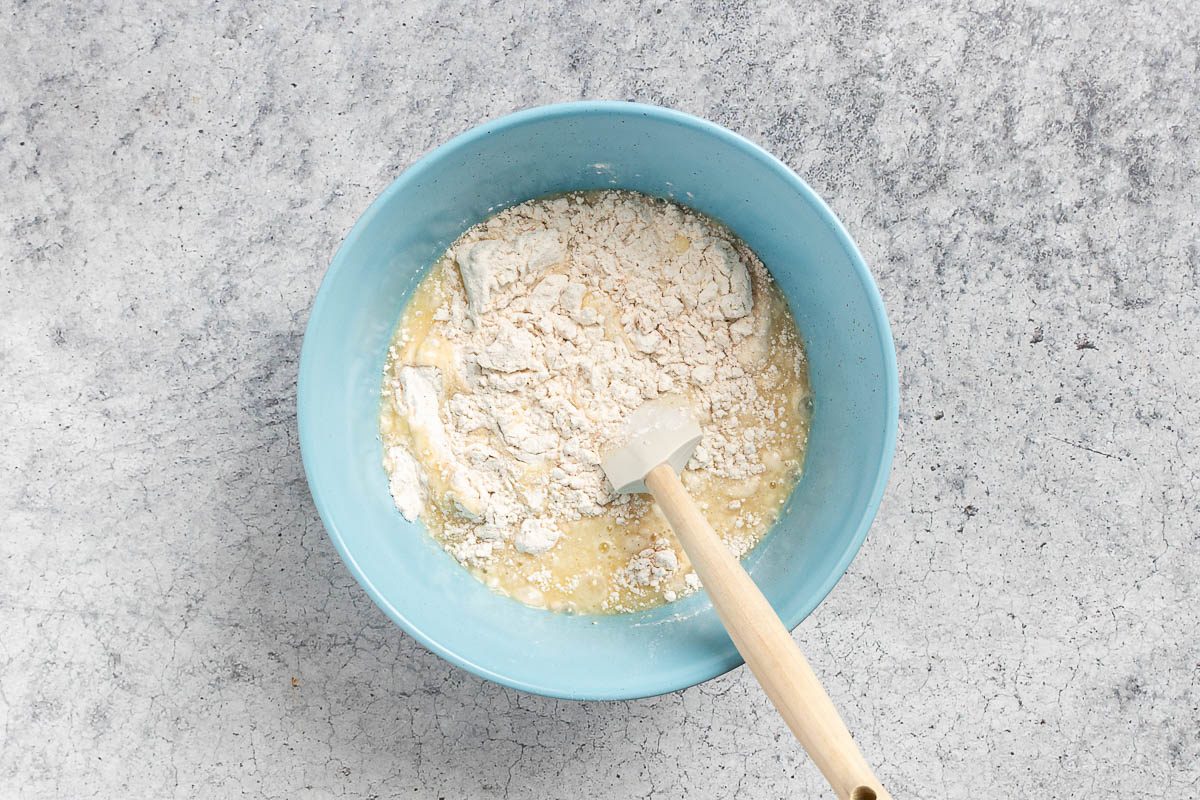 mixing the wet and dry ingredients until moistened.