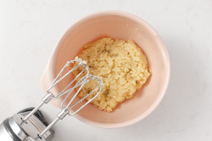 Beaten almond paste, sugar and egg in mixing bowl.