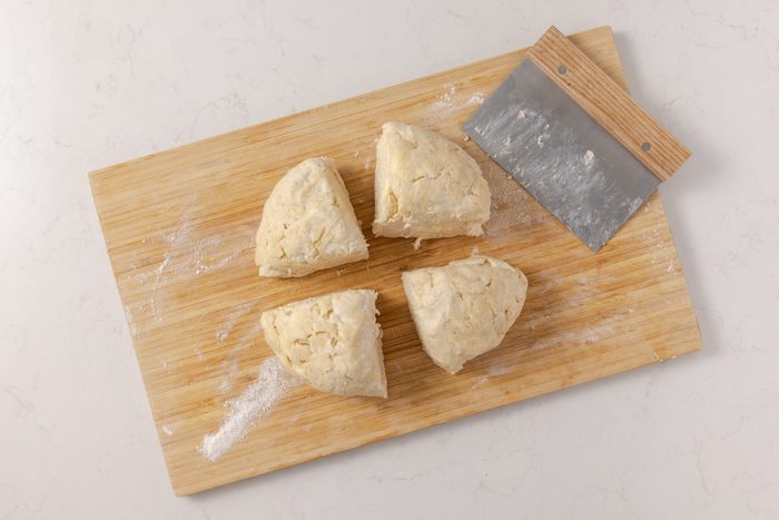 Dough divided in four equal parts to be rolled and filled with almond paste mixture.