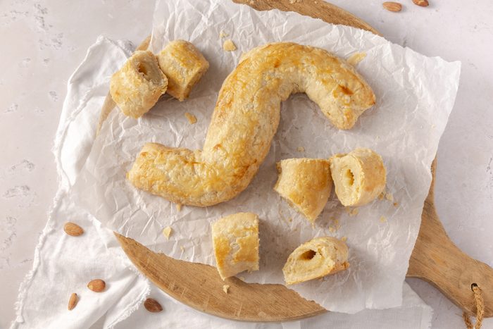Dutch letters baked, served on wood board.