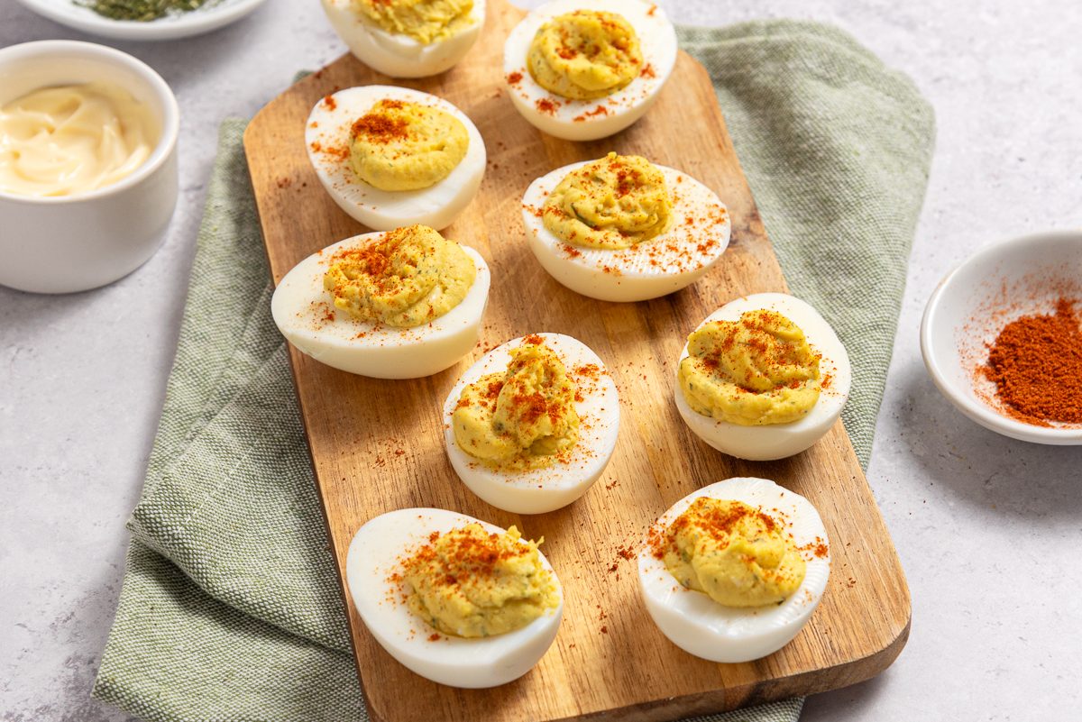 Horseradish Deviled Eggs On Wood Board