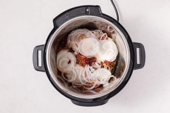 Onions, peppers and salsa added to instant-pot.