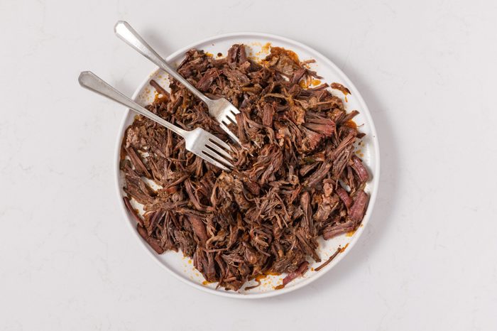 Beef chuck roast shredded after being cooked in the instant-pot.
