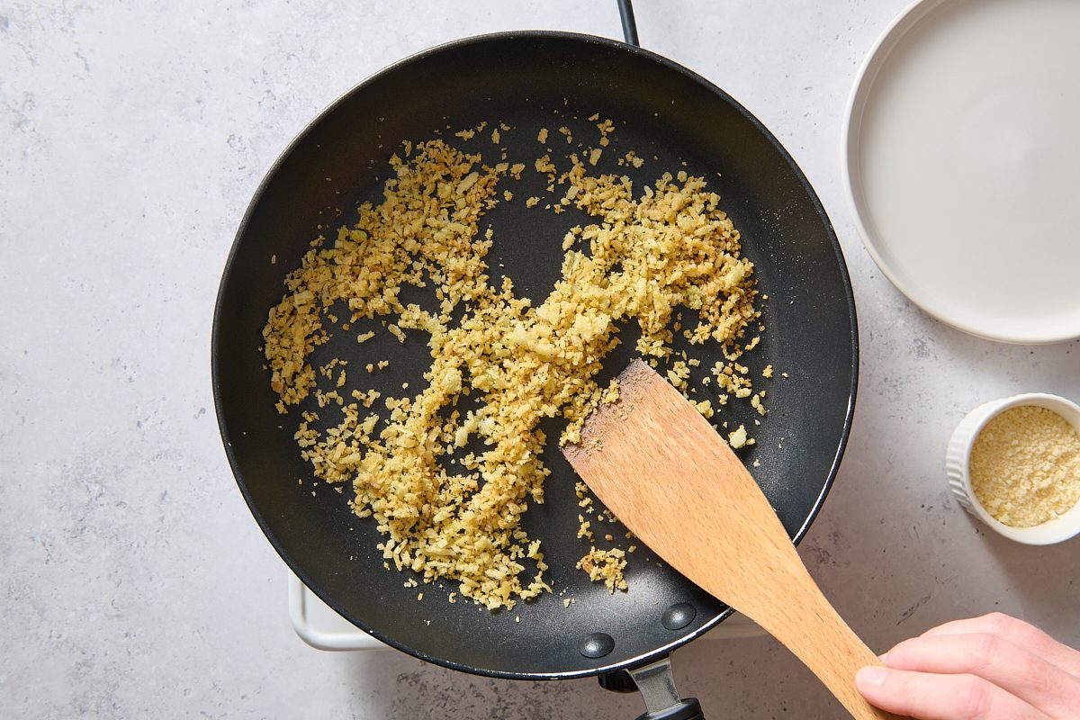 Cooking the breadcrumb mixture in a skillet