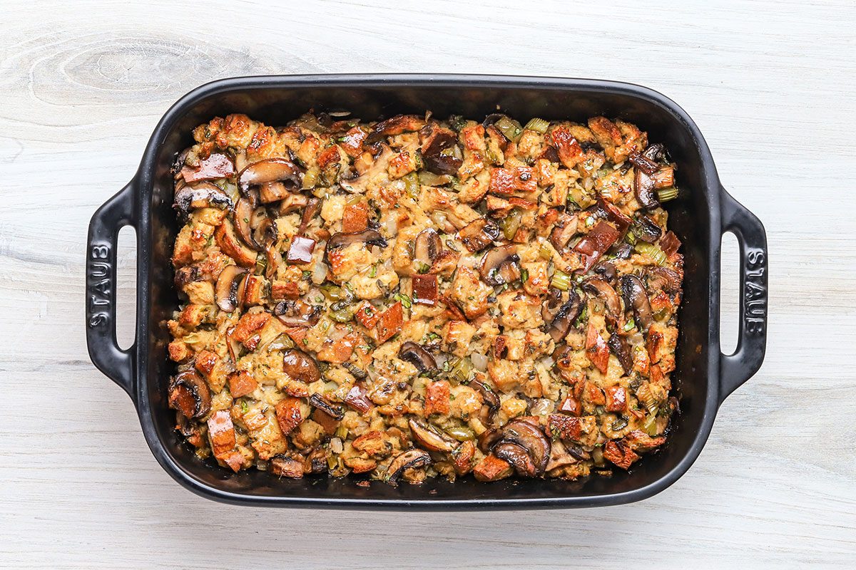 Baked keto stuffing made with low carb keto bread, mushrooms, celery, onions, garlic, sate, butter, and parsley.