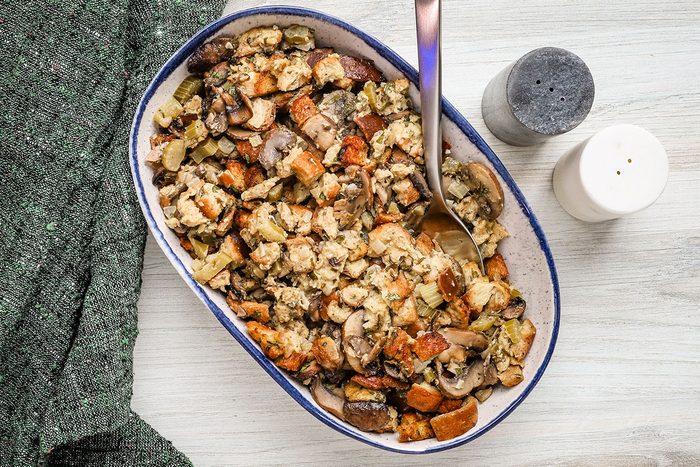 Low carb keto stuffing in a serving bowl with a spoon.