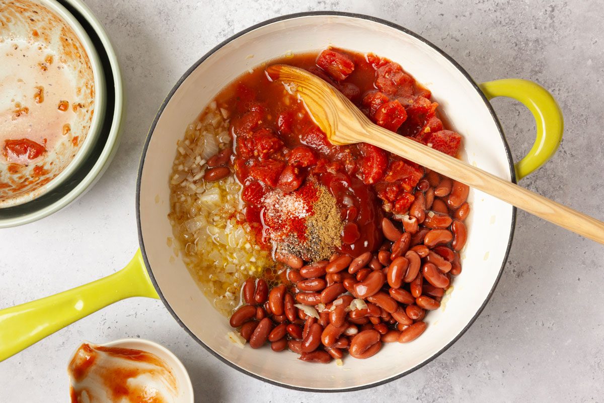Step 2 of Taste of Home Kidney Beans is to stir in the kidney beans, diced tomatoes, water, ketchup, Worcestershire sauce, salt, cumin, paprika, and pepper. Bring the mixture to a gentle simmer, then reduce the heat to low. Let it cook for 15 to 20 minutes, stirring occasionally.