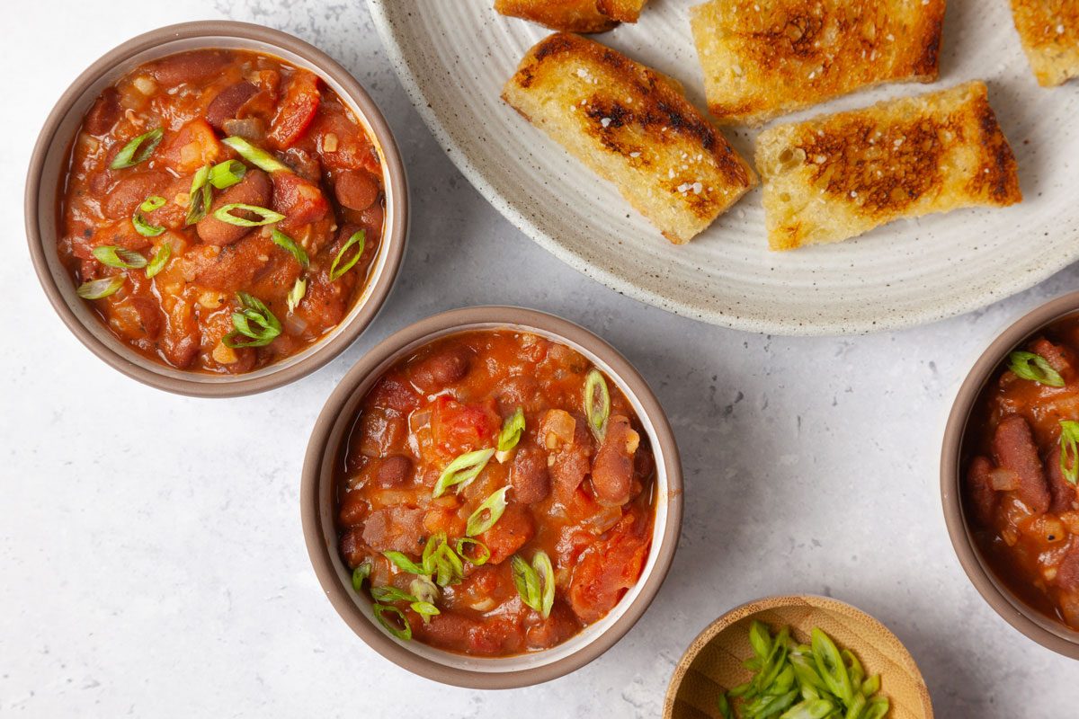Taste of Home Kidney Beans in small ramekin sized bowls, served with toast soldiers and green onion garnish