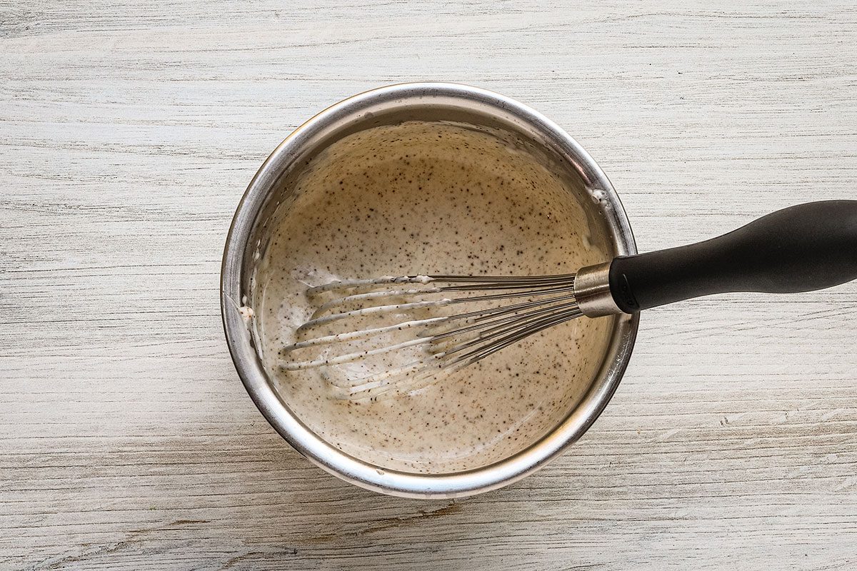 Whisking the dressing mixture for Mexican street corn pasta salad.