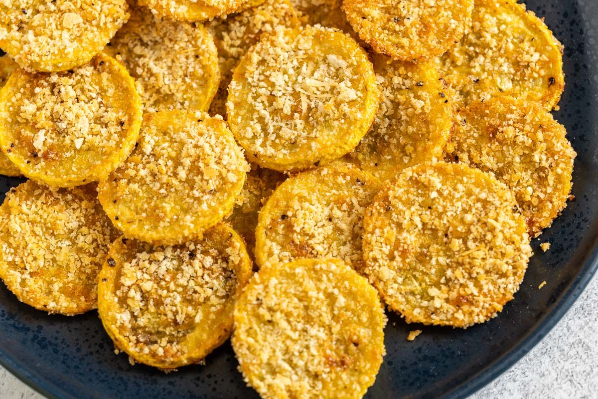 Taste of Home Oven Fried Squash photo of the finished recipe served on a serving dish and plates.