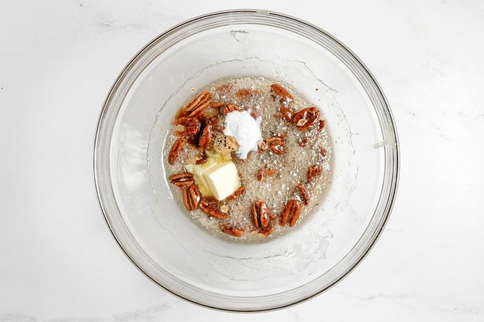 Taste of Home Pecan Brittle in a glass bowl