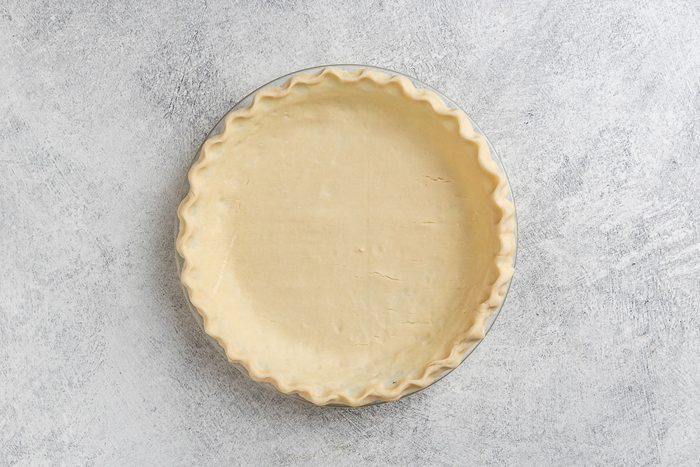 preparing the pie crust in a 9 inch pie pan.