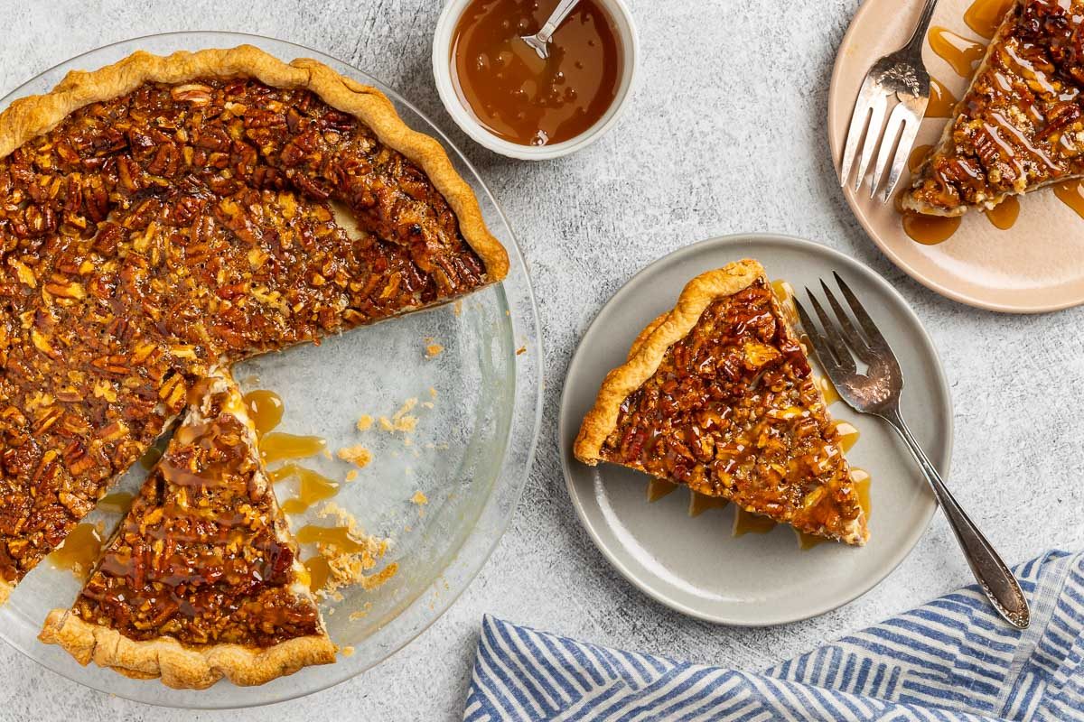 Pecan Cheesecake Pie with a slice served on a plate
