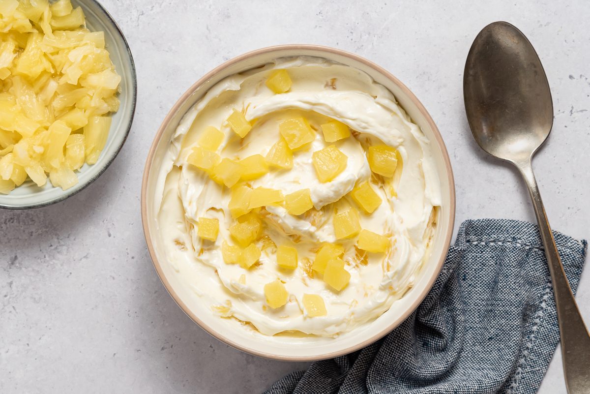 Pineapple Cream Cheese Inside Bowl With Spoon