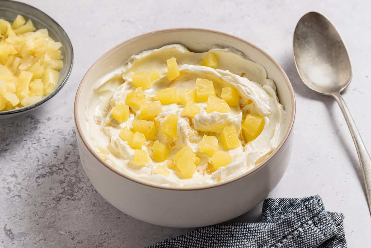 Pineapple Cream Cheese Inside Bowl With Spoon