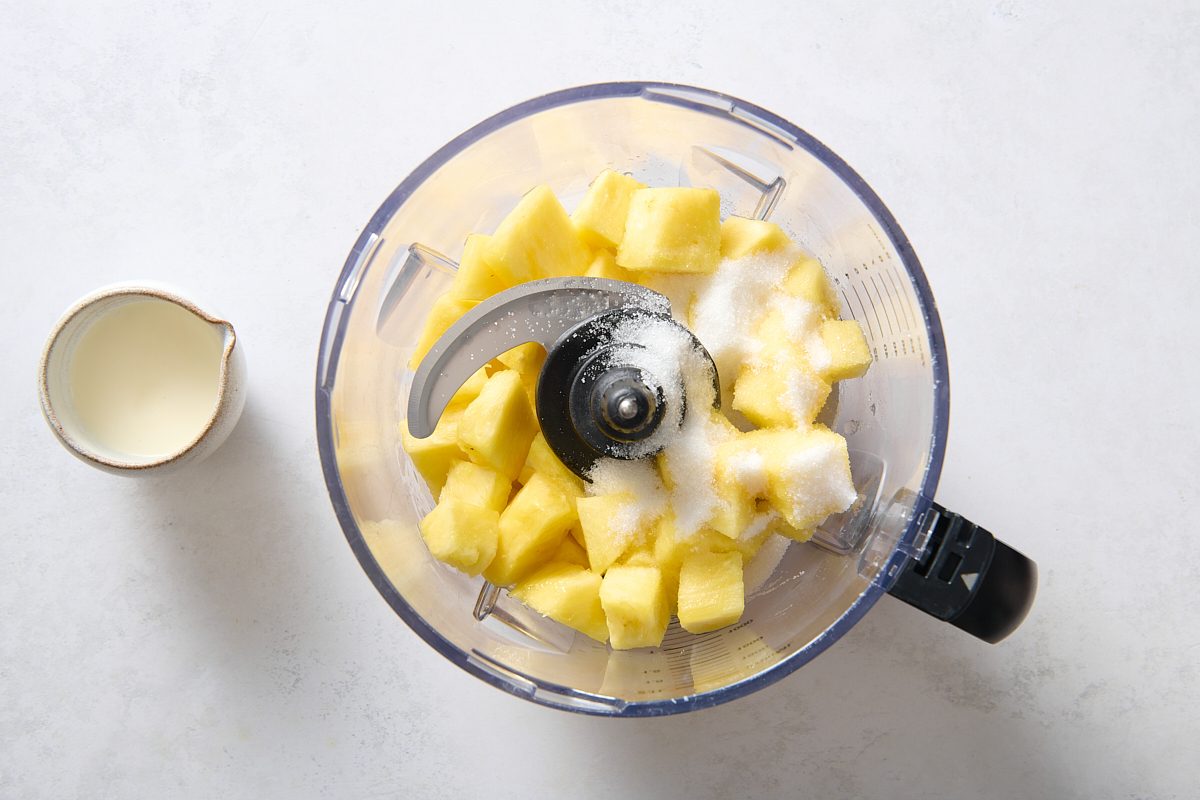 Pineapple Sherbet ingredients in a food processor before being pureed