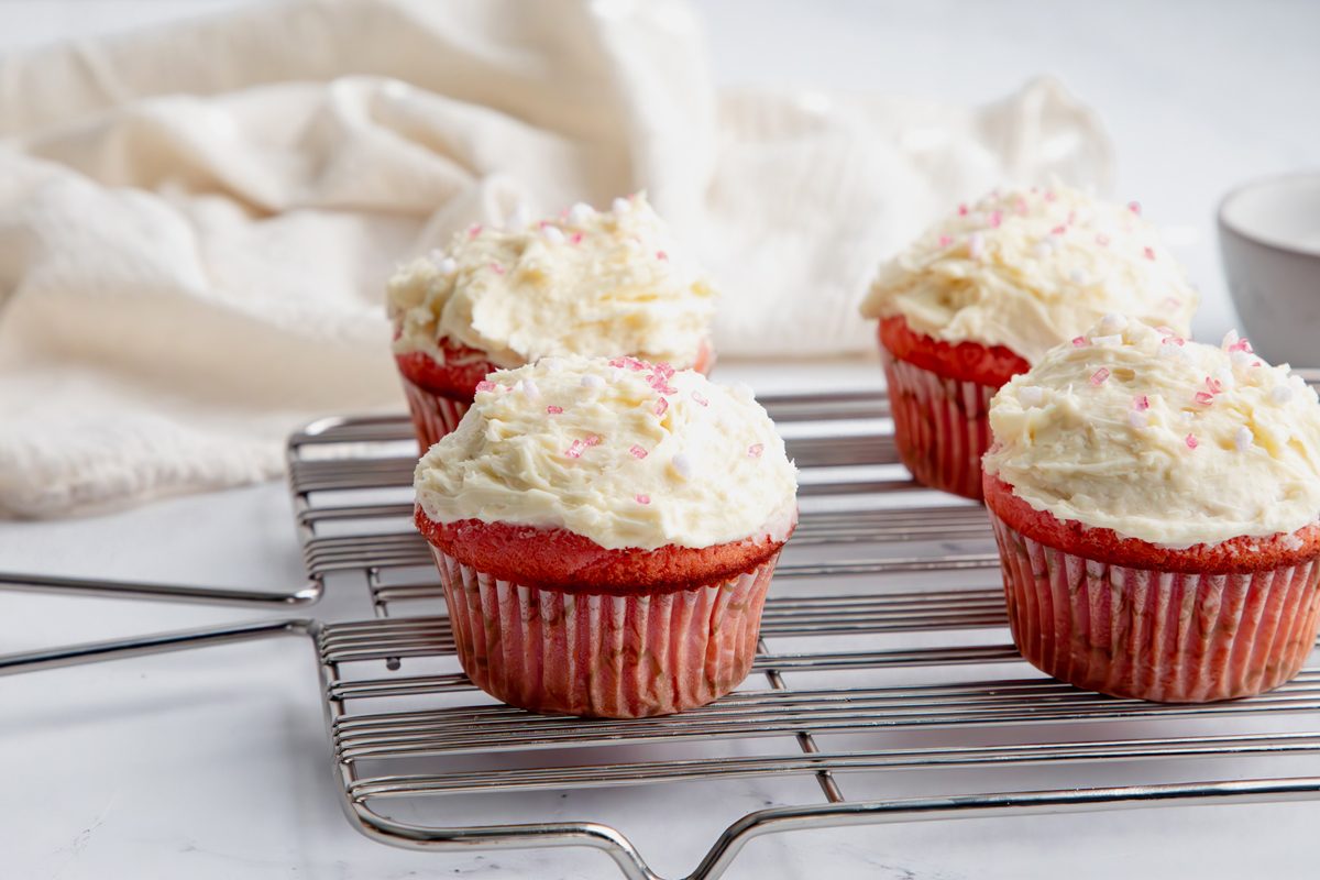 Beauty shot for Taste of Home Pink Cupcakes, cupcakes frosted and topped with sprinkles.