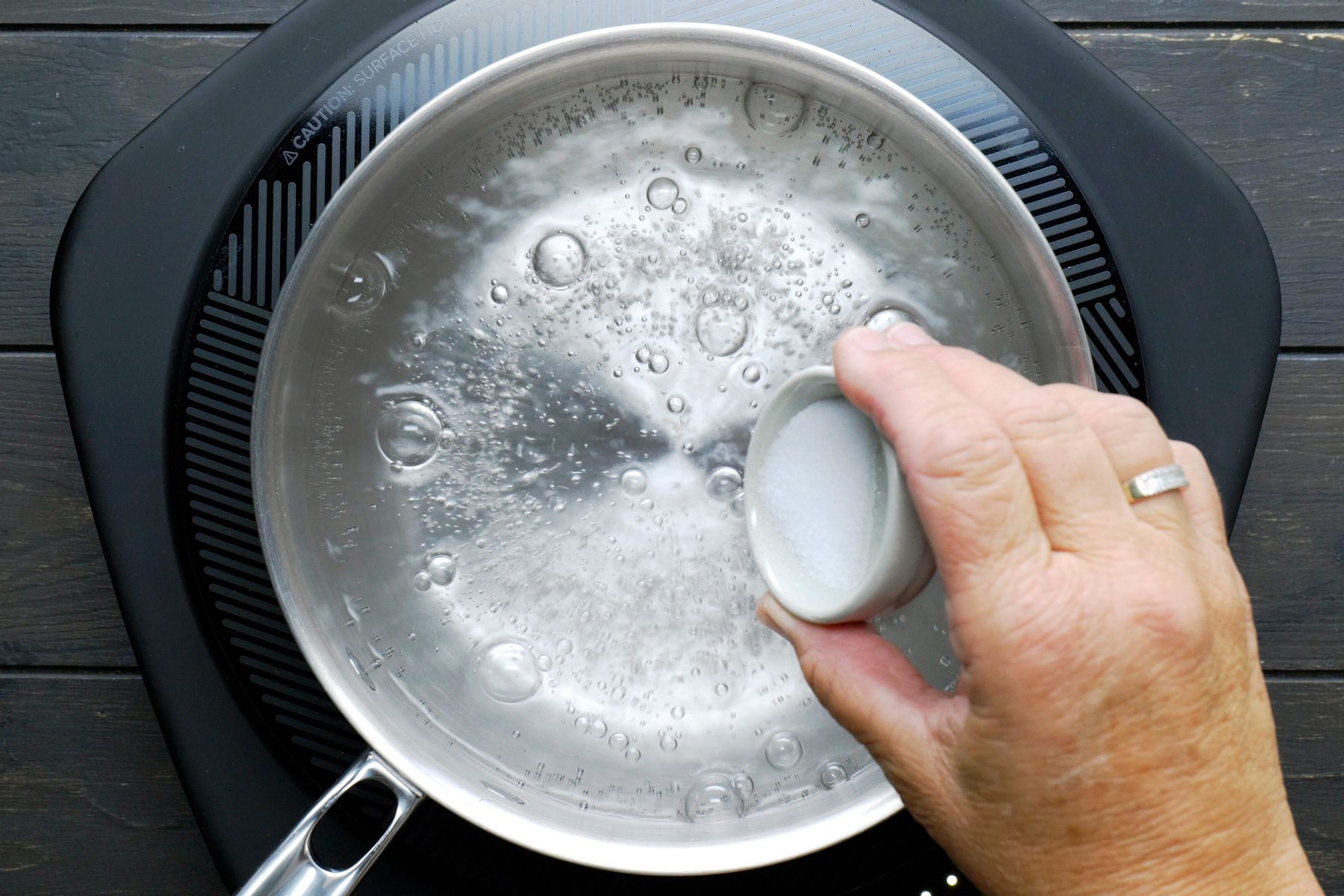 Add vinegar and salt to the boiling water.