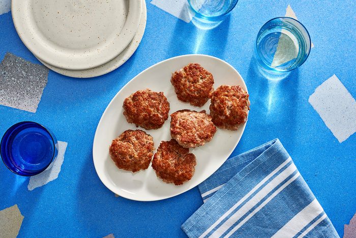 Cooked pork patties arranged on a plate