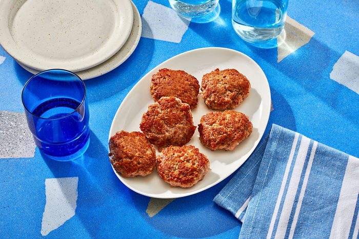 Cooked pork patties arranged on a plate