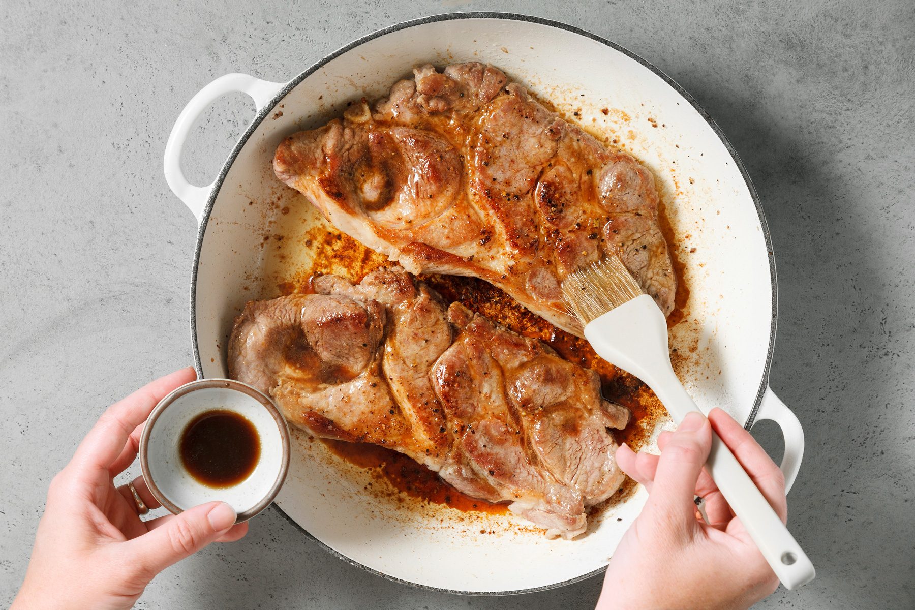 Steaks are brushed with Worcestershire sauce.
